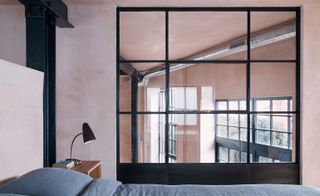 The addition of internal glazing and transparent partitions helps the light travel everywhere in the loft