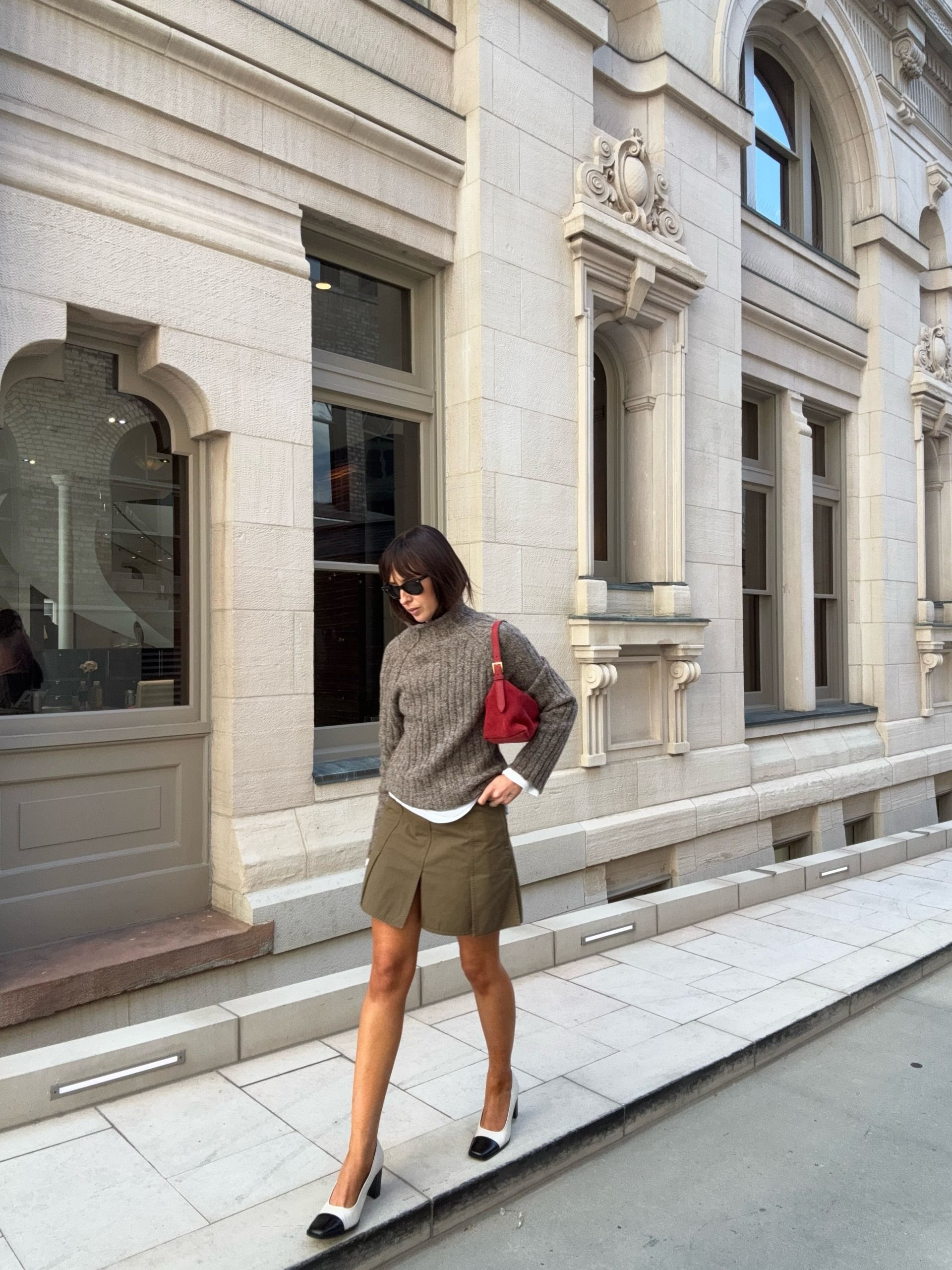 An image of a woman wearing skirt with slits outfit fall 2026