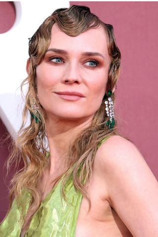 Diane Kruger is pictured with a wet-look sculpted fringe while attending the amfAR Cannes Gala 30th edition Presented by Chopard and Red Sea International Film Festival at Hotel du Cap-Eden-Roc on May 23, 2024 in Cap d'Antibes, France