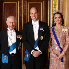 King Charles Prince William Princess Kate posing in formalwear