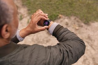 Someone wearing the Fitbit Sense smartwatch