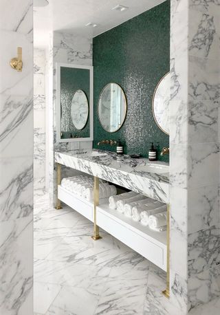 Marble bathroom showing a marble sink, floor and walls