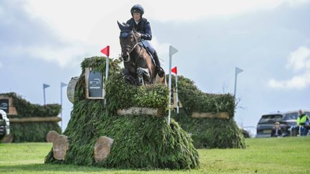 Tom McEwen and JL Dublin jump a cross-country fence at Bramham Horse Trials 2026.
