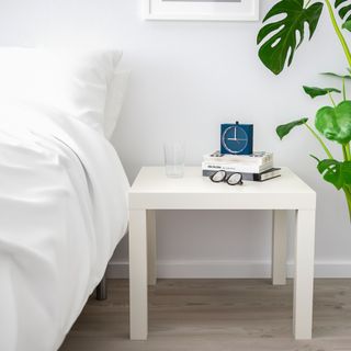 White side table in bedroom