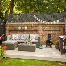 outdoor and sofa set with cushion and brick wall