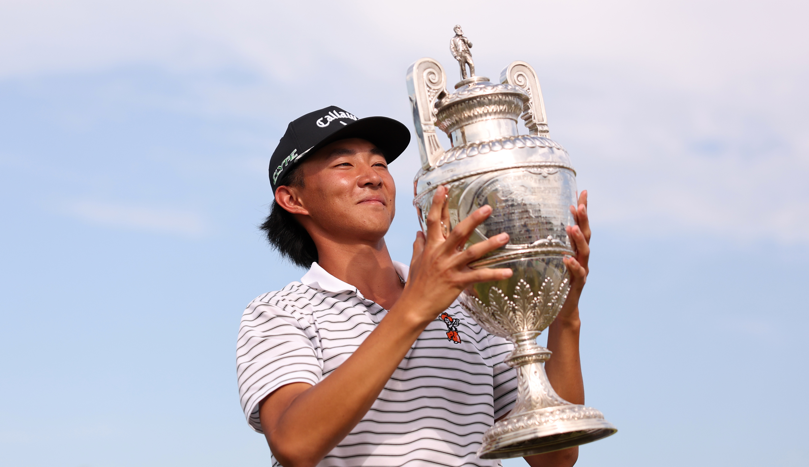 Ethan Fang holds The Amateur Championship trophy