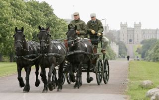 Prince Philip, Duke of Edinburgh drives along The Long Walk