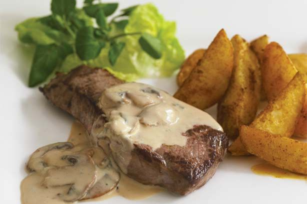 Steak with Stilton and mushroom sauce