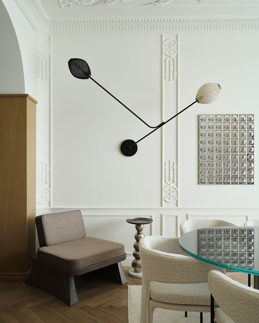 A dining table next to a lounge seat