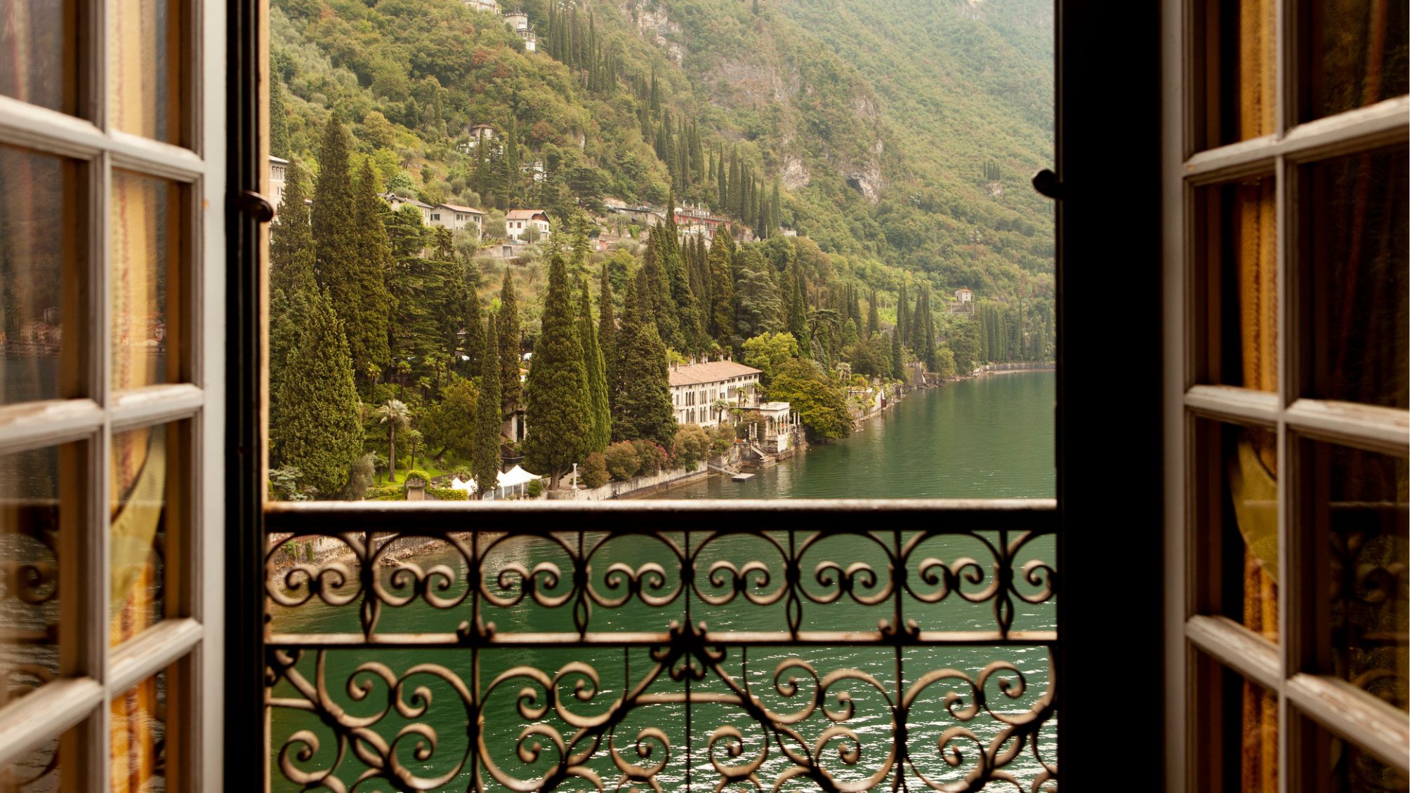 Doors opening to views of Lake Como in Italy.
