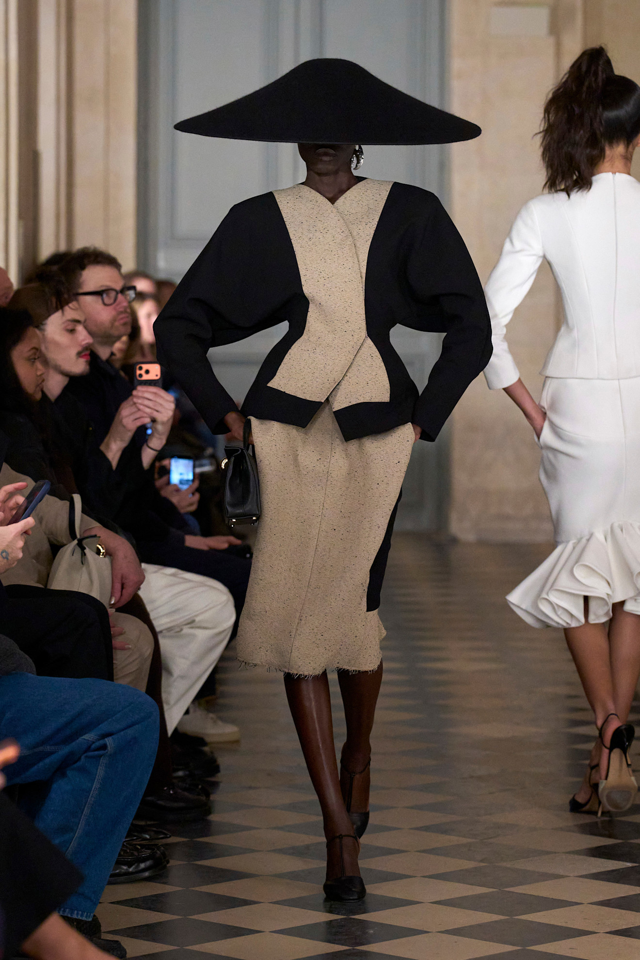 A model wore an oversize hat on the Jacquemus Fall 2026 runway