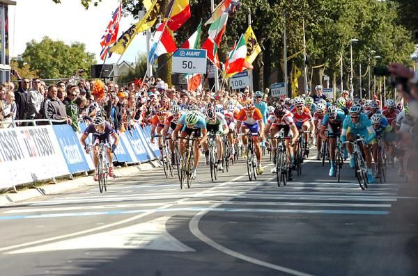 Bryan Coquard (France), far left, looks across at the finish line to see how he's finished.