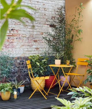 small garden layout ideas: Dobbies bistro set in courtyard