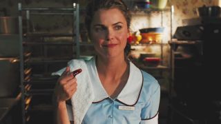 Keri Russell as Jenna in waitress outfit with berries on her finger in 2007's Waitress