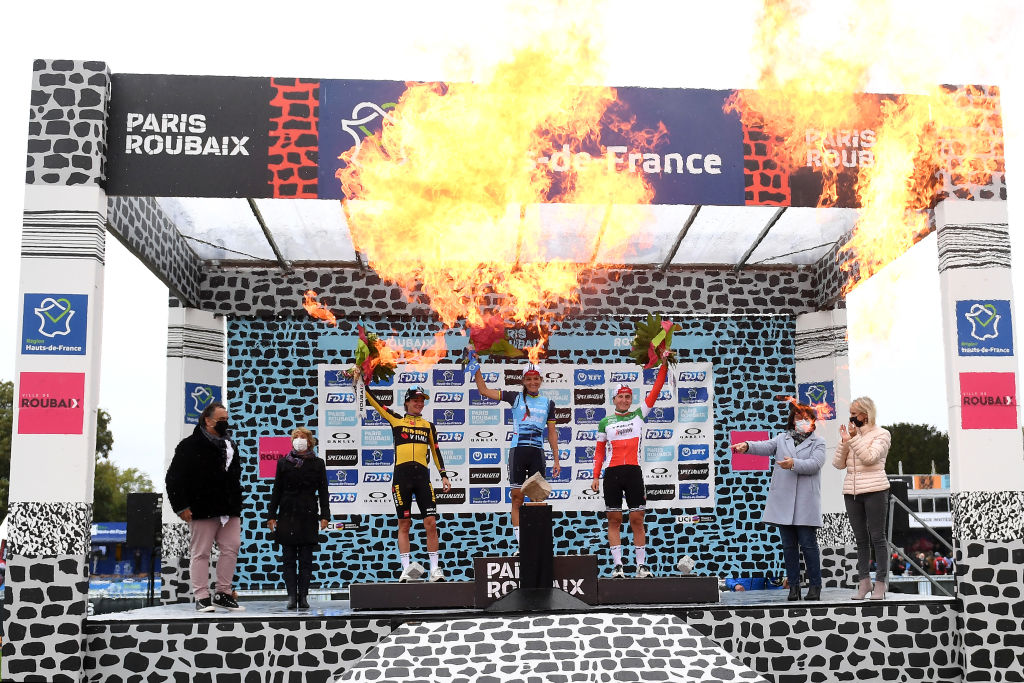 ROUBAIX, FRANCE - OCTOBER 02: (L-R) Marianne Vos of Netherlands and Jumbo Visma Team on second place, stage winner Elisabeth Deignan-Armitstead of United Kingdom and Team Trek - Segafredo and Elisa Longo Borghini of Italy and Team Trek - Segafredo on third place, pose with trophies on the podium during the podium ceremony after the 1st Paris-Roubaix 2021 - Women&amp;apos;s Elite a 116,4km race from Denain to Roubaix / #ParisRoubaixFemmes / #ParisRoubaix / on October 02, 2021 in Roubaix, France. (Photo by Tim de Waele/Getty Images)