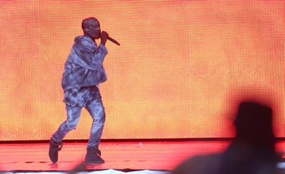 Kanye West stops show, demands wheelchair-bound fan 'stand up'