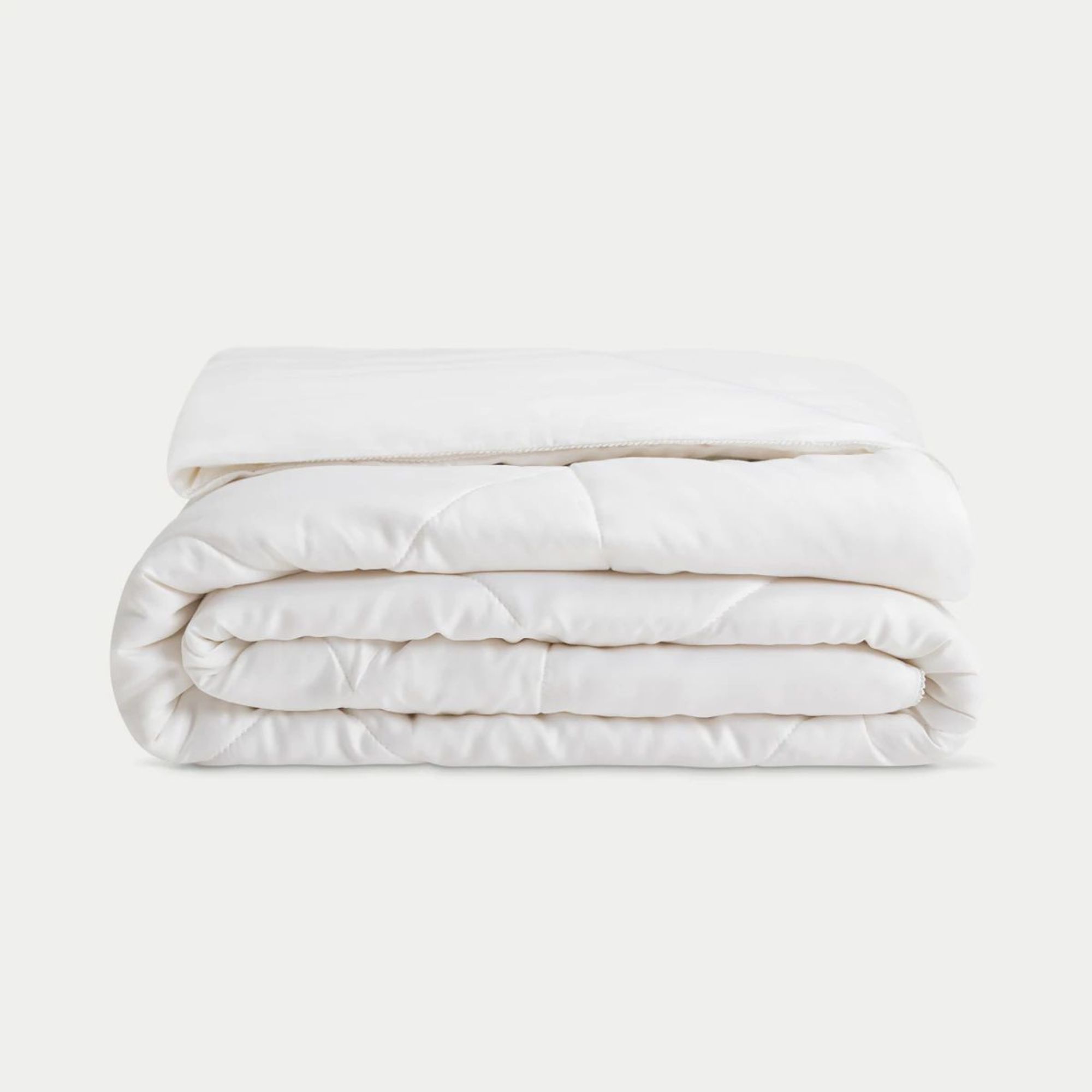 Cozy Earth Bamboo Comforter against an off-white background.