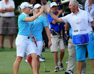 Charley Hull and Mark Wallington high-five at the 2013 Solheim Cup