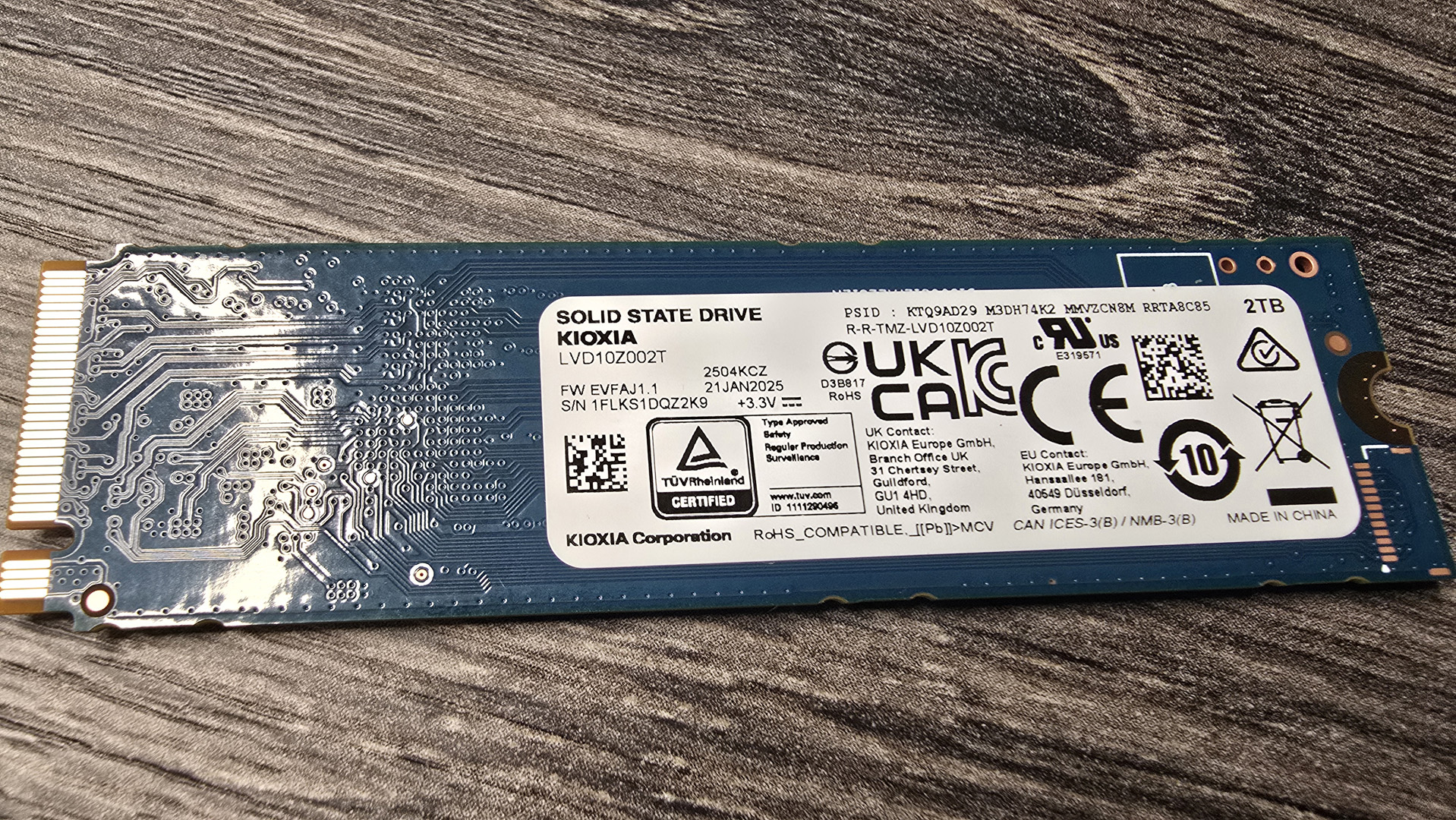 The Kioxia Exceria Plus G4 on a desk, ready to be installed inside a gaming PC.