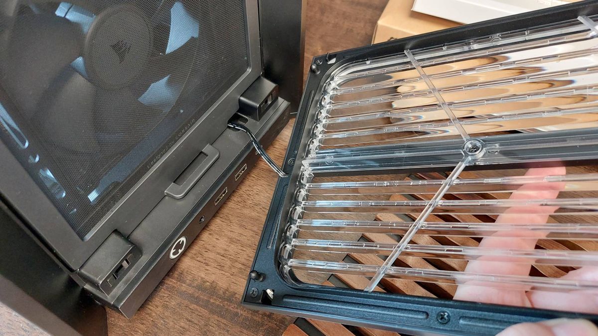 The Corsair Frame 4000X PC case seen at various stages of a PC build. This is a modular, mid-tower case with lots of options for customisation.