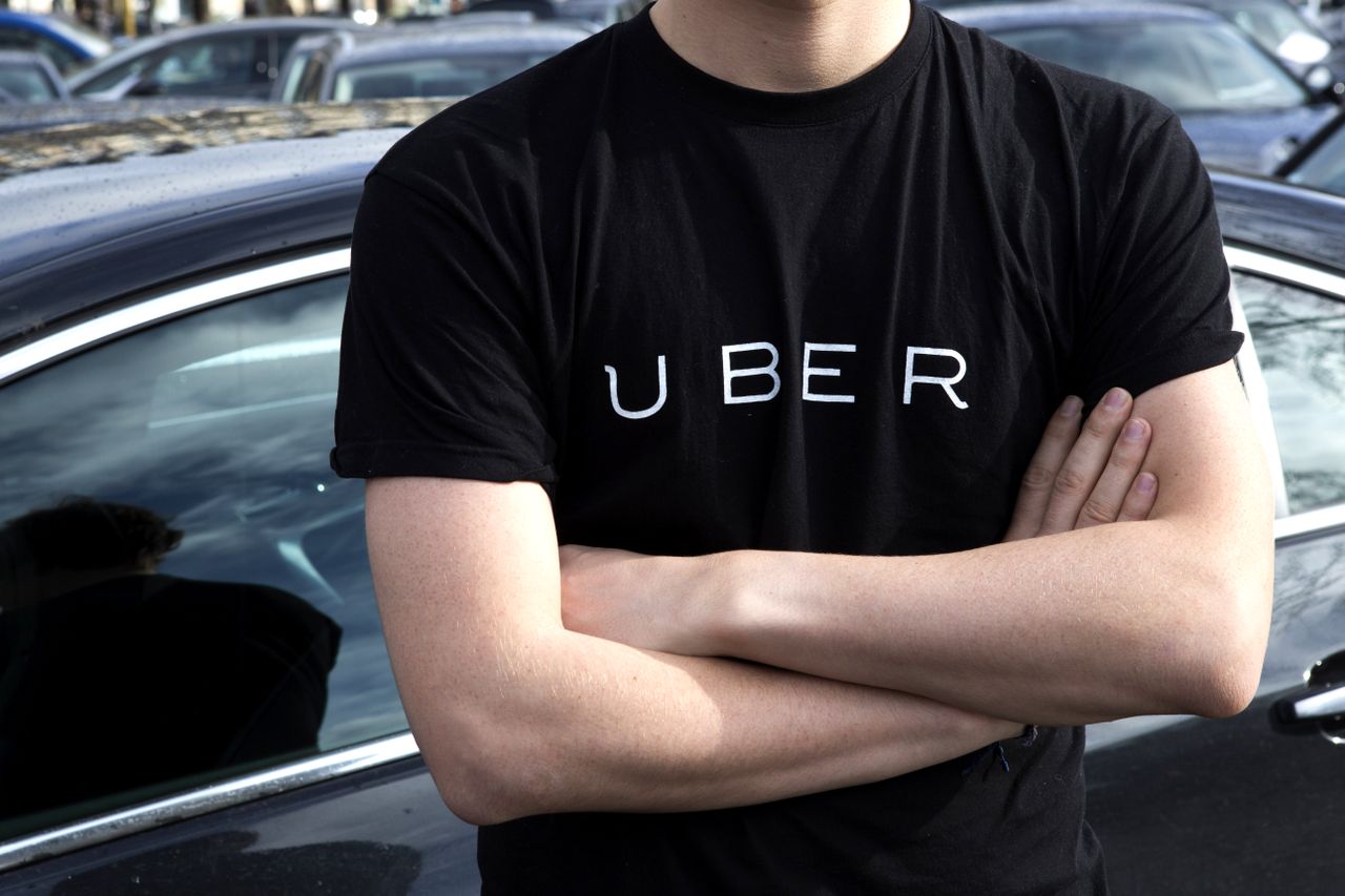 A protester wearing an Uber sweatshirt