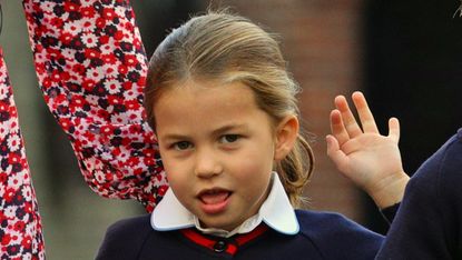 Princess Charlotte of Cambridge gestures as she arrives for her first day of school at Thomas's Battersea in London on September 5, 2019
