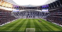 A general view inside the stadium as fans hold up pieces of fabric to display a message of 'Dare Dream Do' prior to the Premier League match between Tottenham Hotspur and Arsenal at Tottenham Hotspur Stadium on May 12, 2022 in London, England.