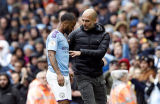 Pep Guardiola speaks to Raheem Sterling after he is substituted