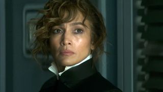 A close up of Jennifer Lopez wearing a black jacket and white shirt in Atlas.