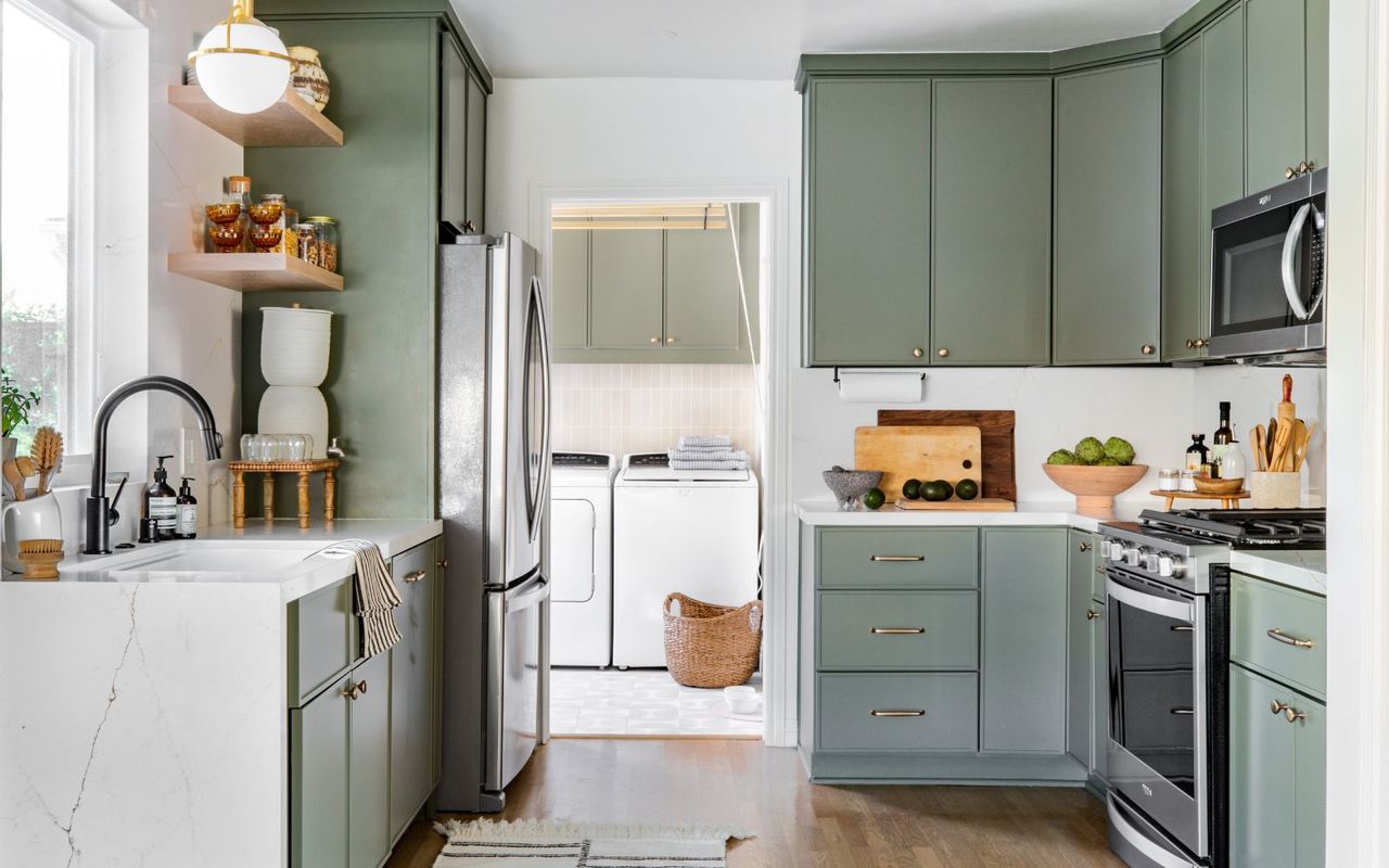 Green kitchen with laundry room