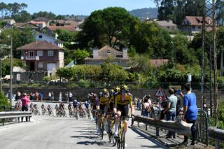 MOS SPAIN SEPTEMBER 04 Nathan Van Hooydonck of Belgium and Team Jumbo Visma leads the peloton during the 76th Tour of Spain 2021 Stage 20 a 2022km km stage from Sanxenxo to Mos Alto Castro de Herville 502m lavuelta LaVuelta21 on September 04 2021 in Mos Spain Photo by Tim de WaeleGetty Images