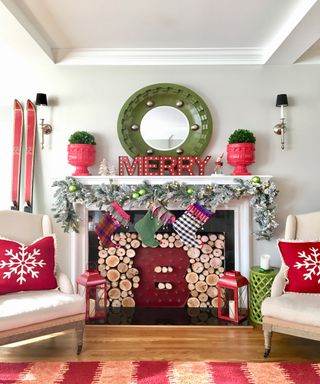 Traditional colors on Christmas mantelpiece with mirrors, stockings and garlands