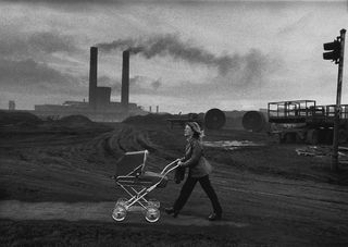 A mother with her new pram and baby in the steel town of Consett, County Durham, England, 1974