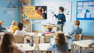 A teacher uses a digital display to teach kids how to stay safe.