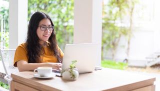 woman working from home laptop with a vpn