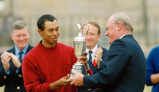 Tiger Woods receives the Claret Jug