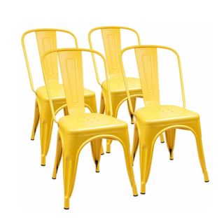 A group of four bright yellow iron chairs with curved open backs and a stripe through the middle of each one