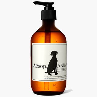 aesop animal wash in brown bottle against grey background