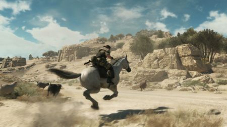 Metal Gear Solid 5 screenshot showing Snake riding a horde through Afghanistan
