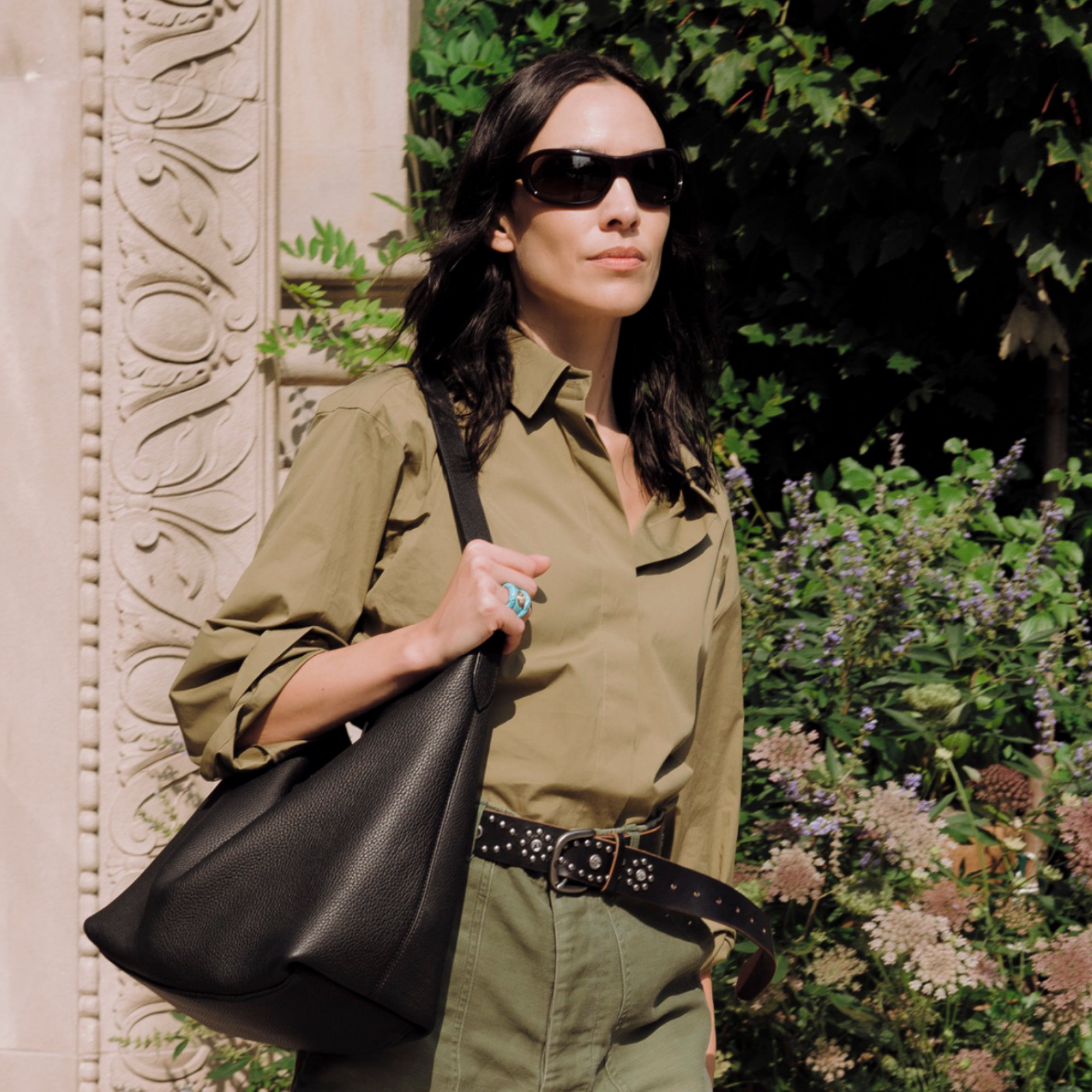 Alexa Chung spotted on the Lower East Side in New York City wearing mid-length shorts.