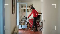 Woman walking out of front door carrying a bike and wearing exercise gear after learning how many calories does cycling burn