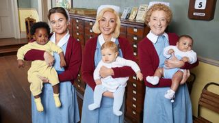 Nancy Corrigan (MEGAN CUSACK), Trixie Franklin (HELEN GEORGE) and Phyllis Crane (LINDA BASSETT) holding babies in Call the Midwife