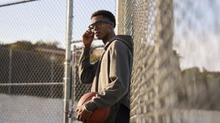 The Oakley Meta HSTN smart glasses being used by a basketball player