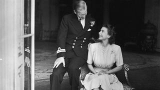 Prince Philip and a then Princess Elizabeth announcing their engagement in 1947