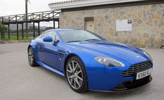 Blue coloured Aston martin virage Jt side view