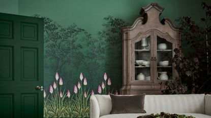 Floral mural with sofa in front and large buffet cabinet