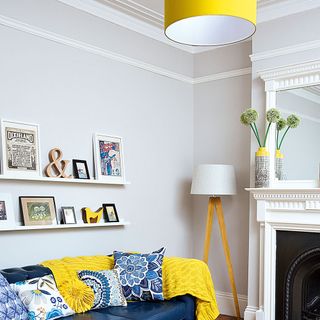 Grey living room with yellow pendant light