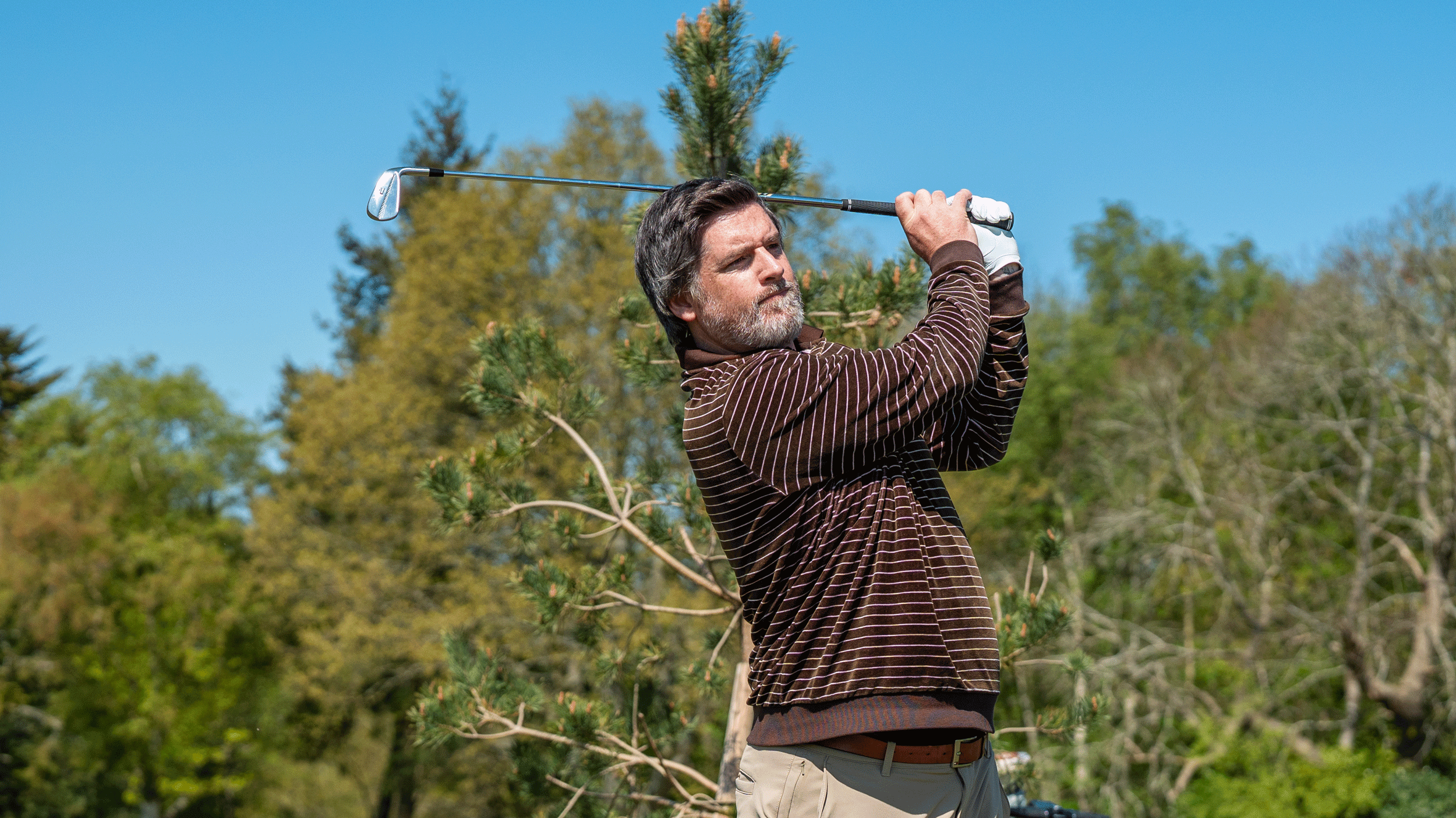 Joe Ferguson hits an iron during the Golf Monthly Spring/Summer testing day at Tandridge Golf Club in 2026