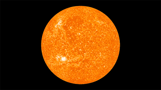 A 3D view of the sun, spinning toward the right.