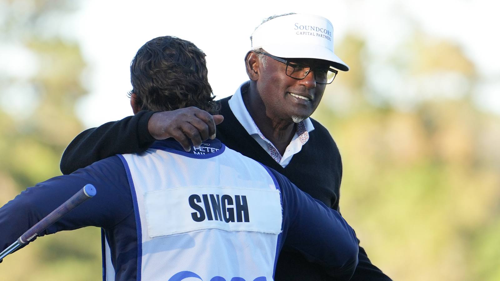 Vijay Singh hugs his caddie